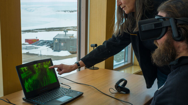 Mawson research station Medical Officer and an expeditioner test a virtual reality headset for the Virtual Space Station program.