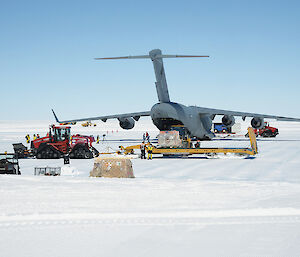 The C17 Globemaster at Wilkins Aerodrome surrounded by cargo.