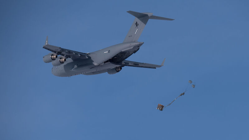 The RAAF C-17A drops spare parts for snow blowers near Casey research station.