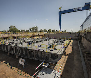 The first block of steel for the new ship, under construction in the shipyard.