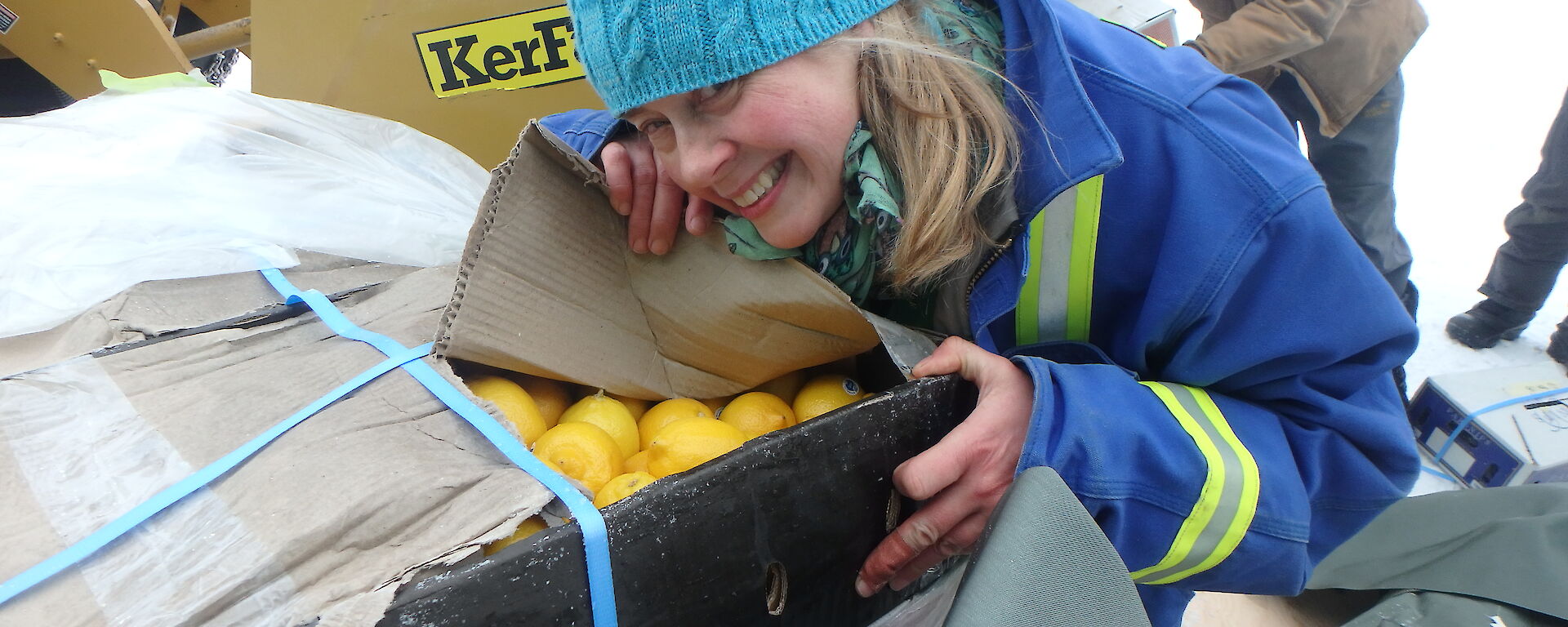 Davis Chef, Kerryn Oates, unpacks a box of fresh lemons.