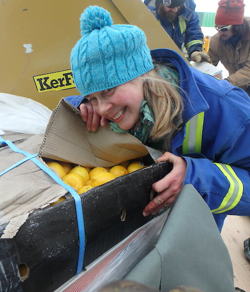 Davis Chef, Kerryn Oates, unpacks a box of fresh lemons.