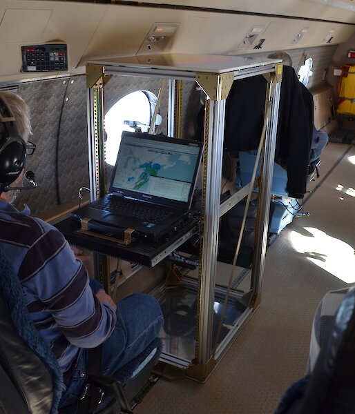 Scientists on board the NSF/NCAR HIAPER Gulfstream V studying real-time data collected by the aircraft’s cloud radar.