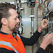 Engineer, Michael Packer, in the Advanced Wastewater Treatment Plant built inside two shipping containers.