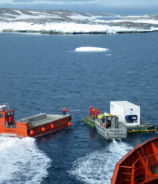 A barge delivering a refrigerated container from the ship to Casey research station.