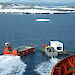 A barge delivering a refrigerated container from the ship to Casey research station.