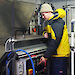 Rob King with a filter table, connected to a fish pump, set up on the Aurora Australis