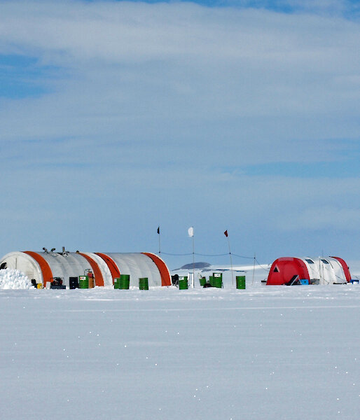 A campsite of semi-circular and polar pyramid tents on the Amery Ice Shelf in 2010.