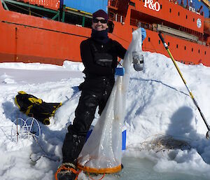 Krill lipid expert, Dr Patti Virtue, catching krill on the sea ice in Antarctica