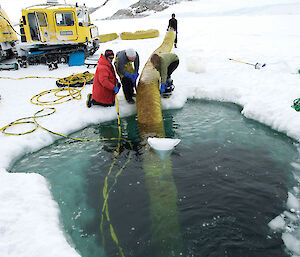 One of the ducts, or ‘slinkies', being recovered to the surface through the dive hole