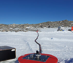 Electronic cables and water pipes ran between the surface and underside of the sea ice via a modified sea ice buoy, nicknamed the ‘smartie’