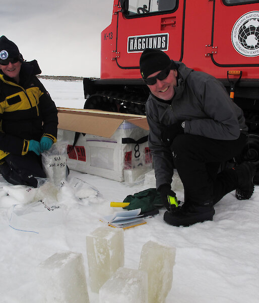 Dr David Etheridge and Dr Andrew Smith take samples of the rare sub-glacial water eruption for analysis