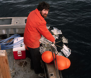 Dr Davidson deploys equipment used to incubate phytoplankton at different depths from the MV Southern Comfort