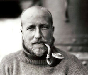 Edward Frederick Robert Bage smoking a pipe, in Antarctica