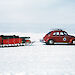 The Ruby-Red Antarctica 1 VW car towing a sled across the snow
