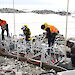 Members of the remediation team take samples from one of the permeable reactive barriers (PRBs) at the site