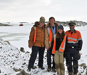 Four of the remediation team members standing at the remediation site in Antarctica.