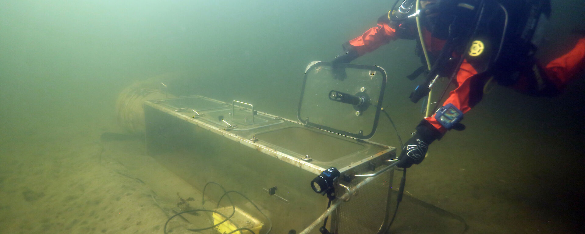 A diver tests one of the chambers in the cold waters of Tasmania before deployment in Antarctica