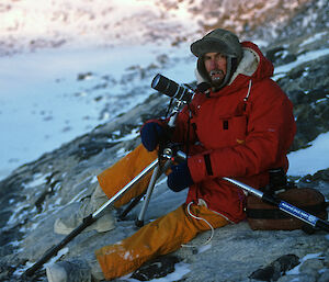 Dr Graham Robertson in 1988 at the start of his career with the Australian Antarctic Division, photographing huddling emperor penguins at Taylor Glacier in mid-winter for counting purposes.