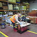 Linda Clark cleans artefacts in the warehouse.