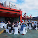 Members of the Hobart Antarctic community enjoy lunch on the helideck of the Aurora Australis to celebrate her 25th birthday.