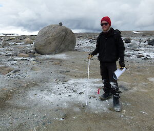 Field Assistant Matt Donoghue inspects a hang-augured site 12 months after excavations. No evidence of disturbance is observed and the soil is now encrusted with salt.