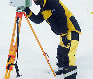 Dr Ernesto Trujillo-Gomez with his laser scanner on the sea ice