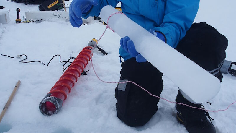Ken uses a lasso to help extract an ice core from the sea ice