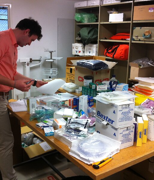 John Cherry reviews the medical supplies inventory for the resupply of Antarctic stations