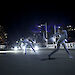 Dancers dressed in white perform ‘Polarity’ in Melbourne’s Federation Square under dramatic lighting