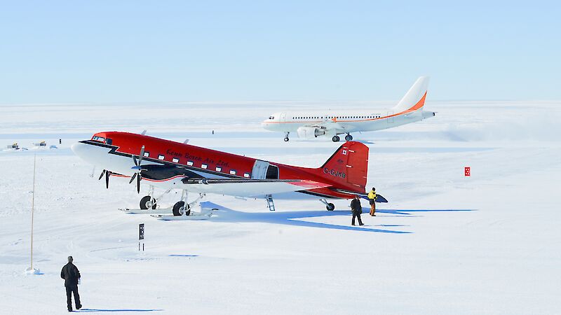 A Kenn Borek Air Basler aircraft in the foreground, with A319 aircraft in the background