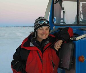 Sharon Labudda leaning on vehicle in Antarctica