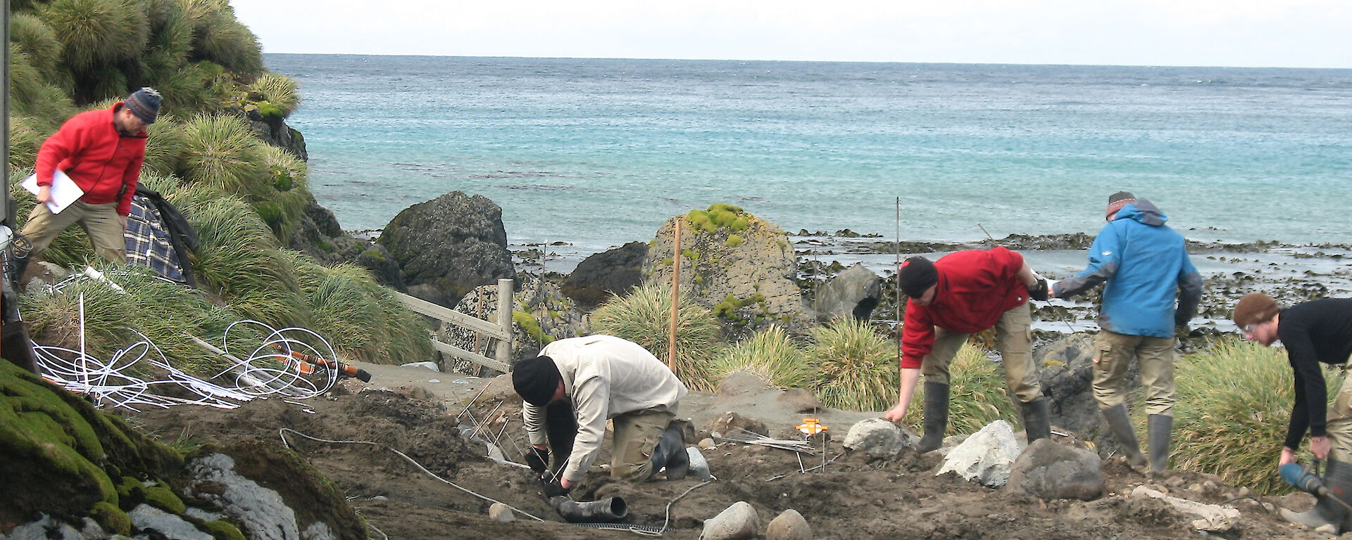 Expeditioners installing piezometers at a fuel contaminated site on Macquarie Island