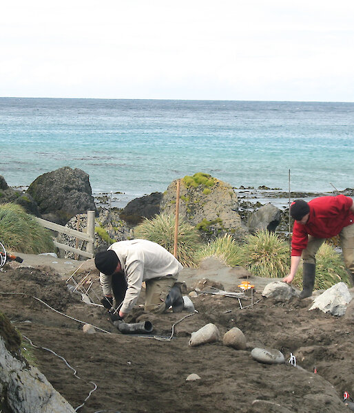 Expeditioners installing piezometers at a fuel contaminated site on Macquarie Island