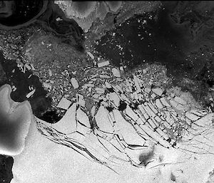 Satellite image showing fully degraded ice bridge, with icebergs slowly migrating out of the area.