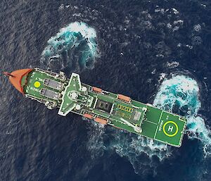 An aerial drone photo. Aerial view of an icebreaker ship in open water. Trails of bubbles and light blue water show how the ship is turning in the water.