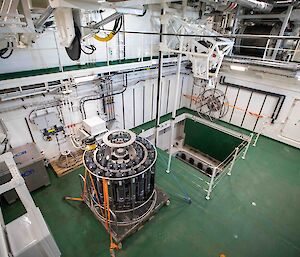 A CTD instrument tied to the deck beside an open shaft on RSV Nuyina.