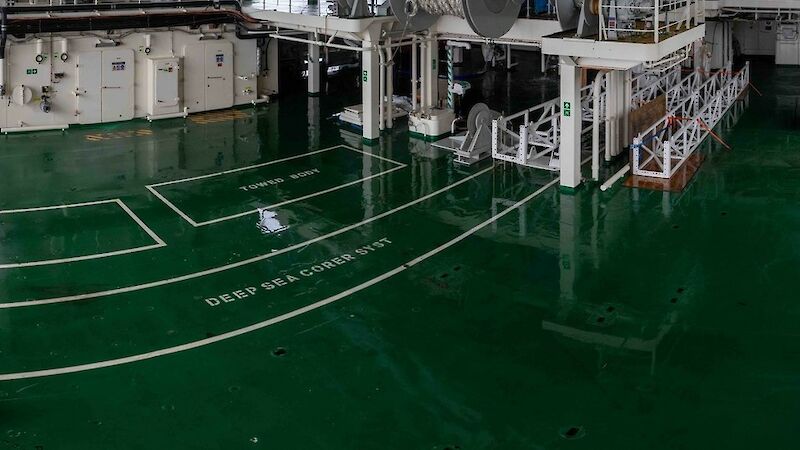 A deck on a ship filled with white equipment.