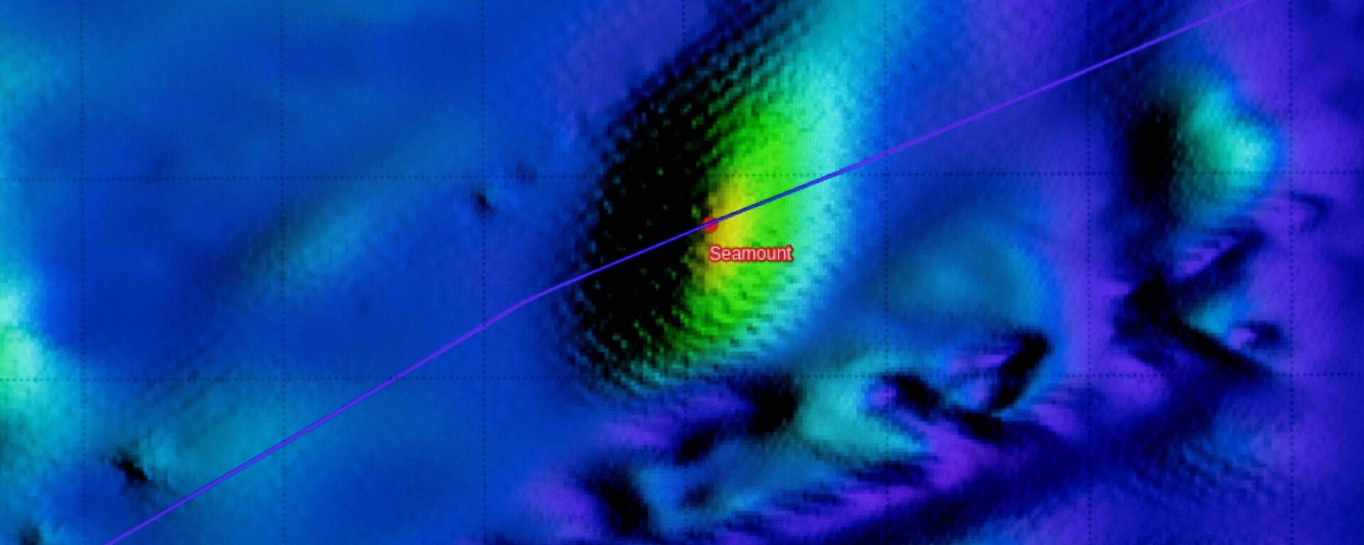 A brightly coloured map of the sea floor depicts the shape of an underwater mountain.