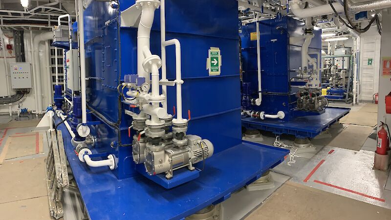Two blue coloured sewage treatment plants on the ship.