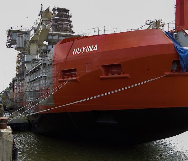 Bow view of Nuyina painted in international orange.