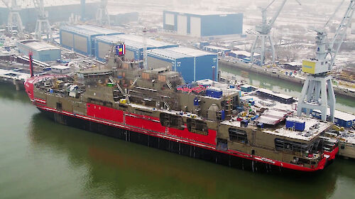 Aerial view of icebreaker Nuyina alongside a wharf in Romania.