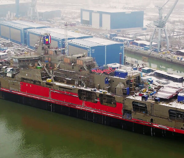 Aerial view of icebreaker Nuyina alongside a wharf in Romania.