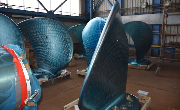 The blades of the ship’s propellers covered in a blue protective coating