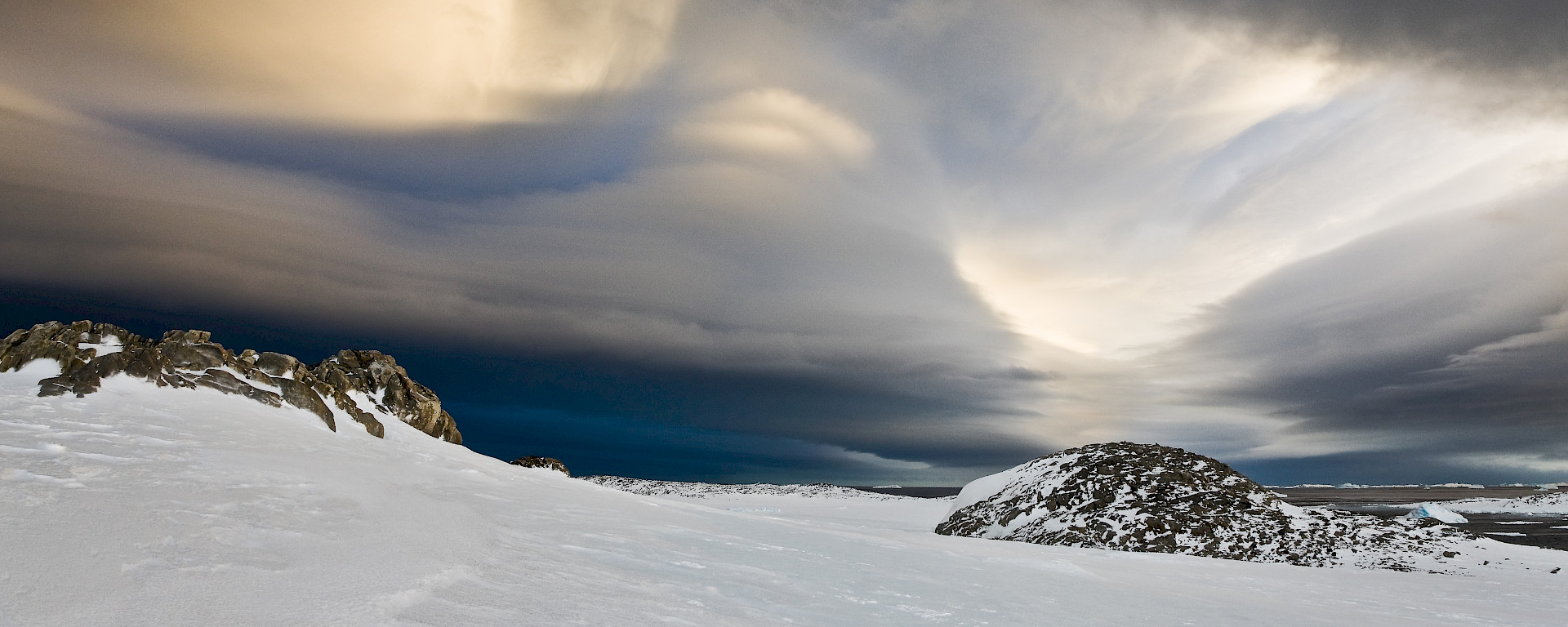 Clouds above an icy landscape.
