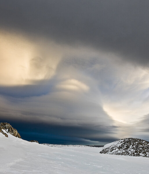 Clouds above an icy landscape.