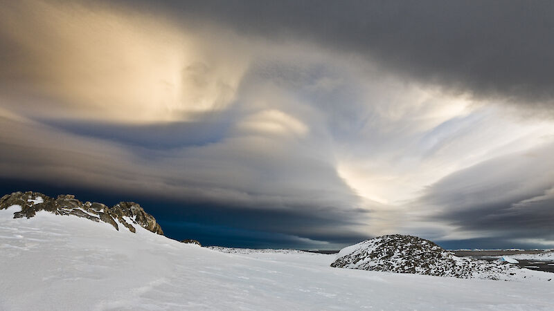 Clouds above an icy landscape.