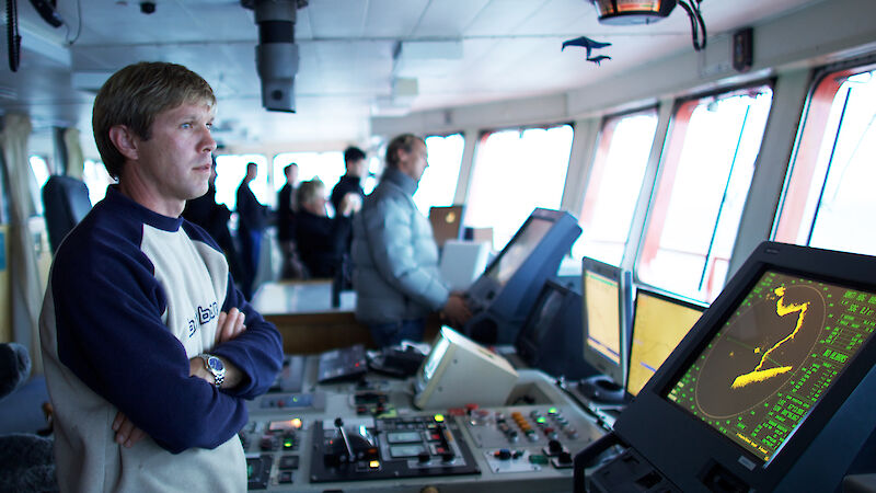 Scott on the bridge with a radar screen in front