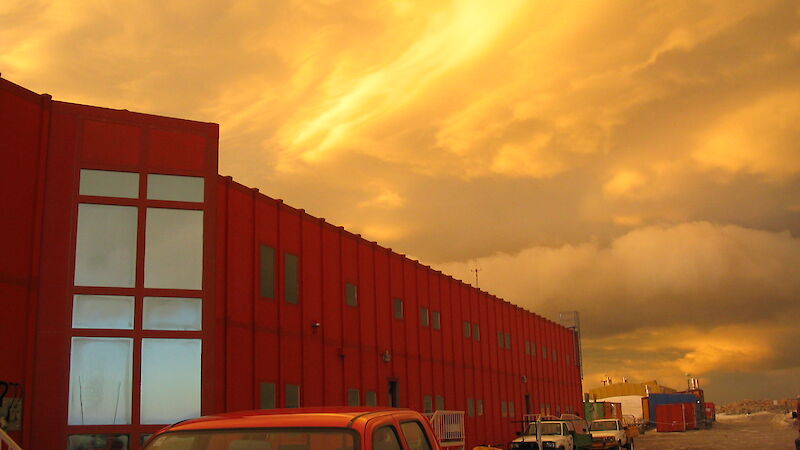 Red Shed with sunset clouds in background