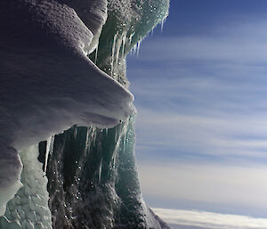 On the left, a large wave-like jade iceberg dominates the shot